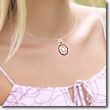diamond pendant worn by on the neck of a woman